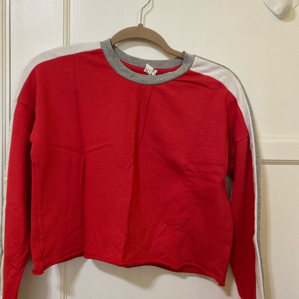 Tilly's red sweatshirt